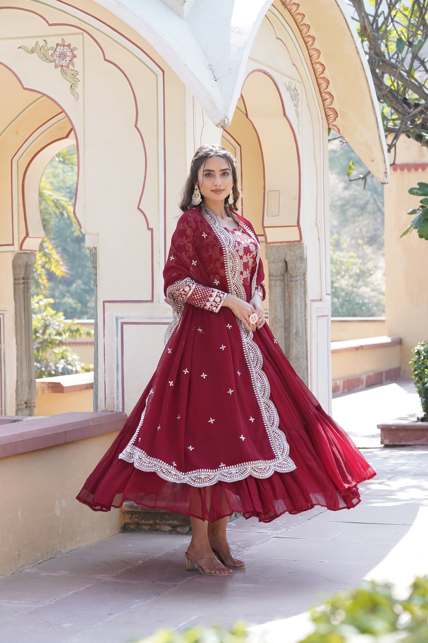 This fully flare dress is paired with lovely organza Bandhni Dupatta which gives perfect ethnic look with Golden embroidery Work Yok for your Indian traditional gathering and parties.