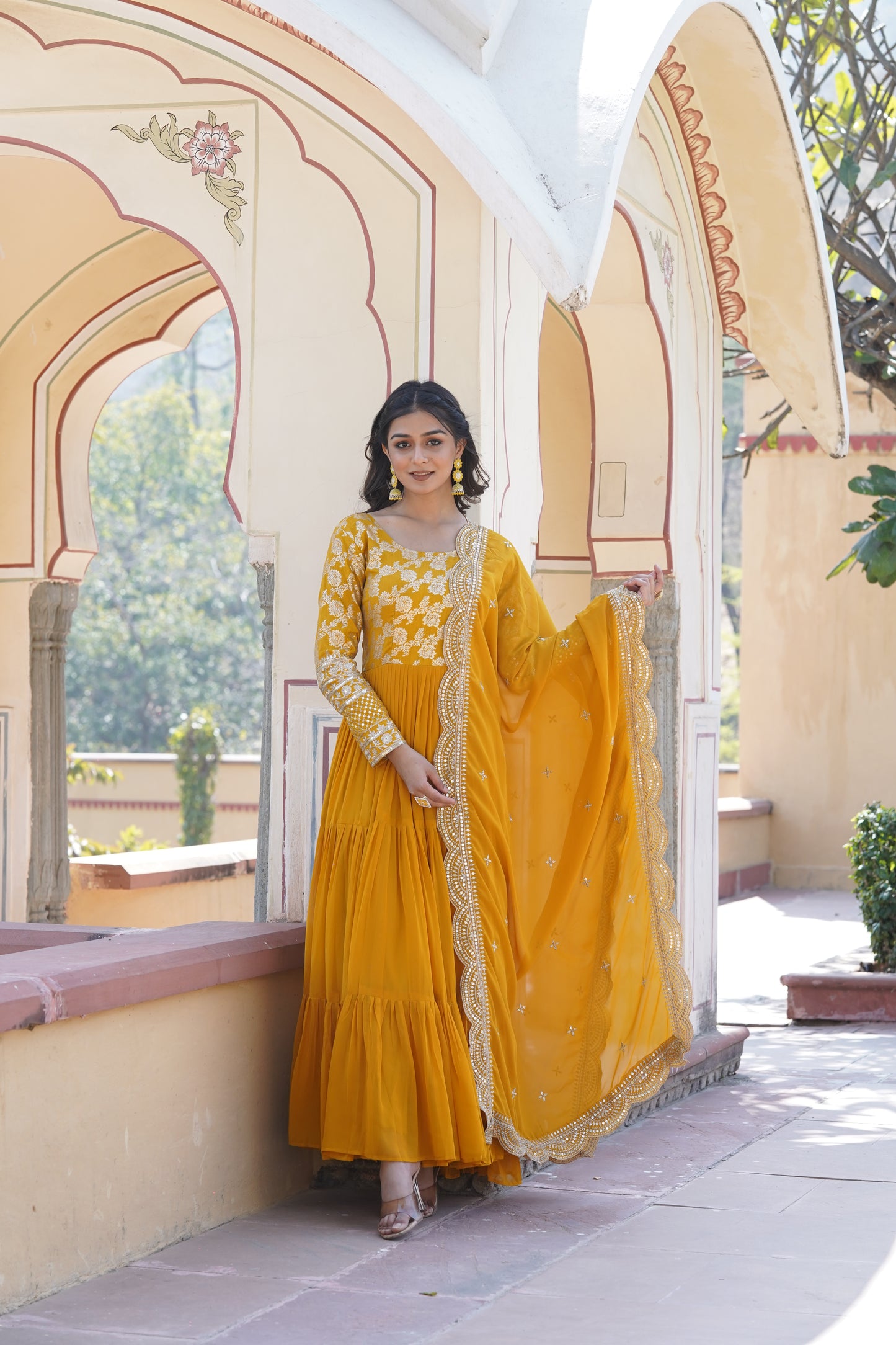 This fully flare dress is paired with lovely organza Bandhni Dupatta which gives perfect ethnic look with Golden embroidery Work Yok for your Indian traditional gathering and parties.